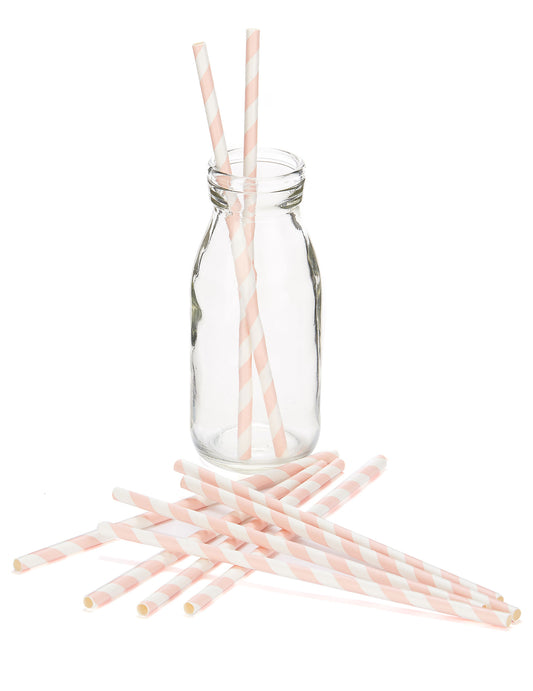 Mise en situation dans une bouteille des pailles en carton rayées pour boissons froides rose et blanc