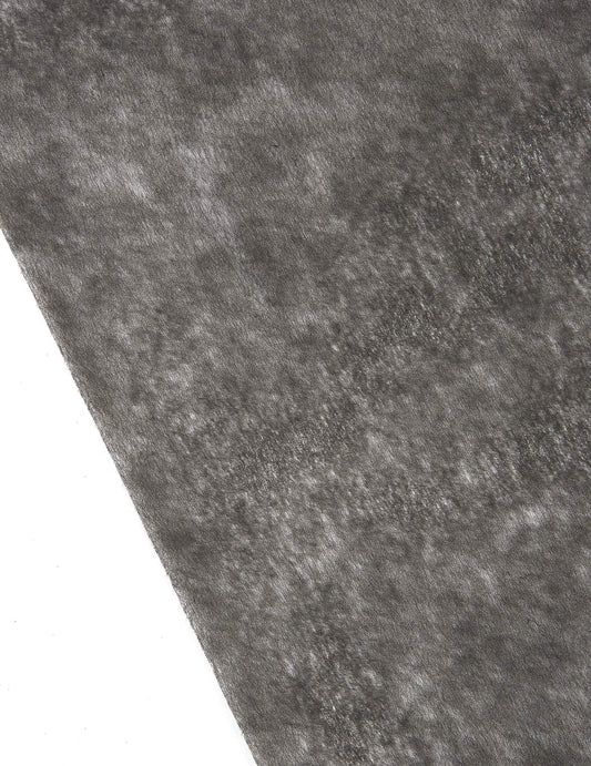 Gros plan sur la texture du chemin de table intissé pour décoration de fête noir