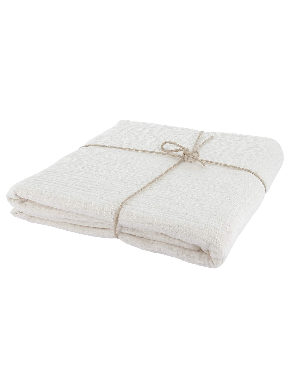 Vue de profil de la nappe pliée avec ficelle de la nappe en gaze de coton style bohème crème