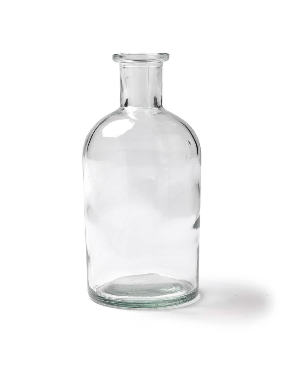 Contenedor de botella en una botella transparente de vidrio