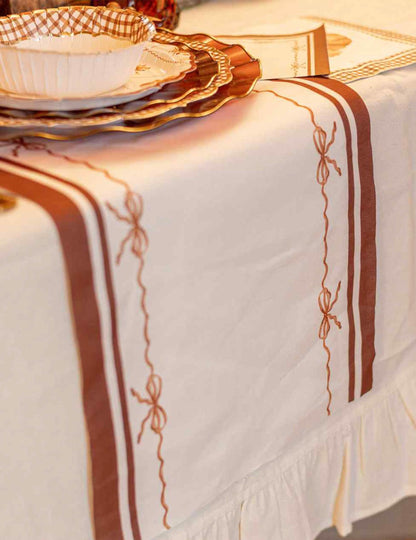 Camino de mesa Lindos nudos en tela crema auburn y tierra quemada 28 cm x 3 m