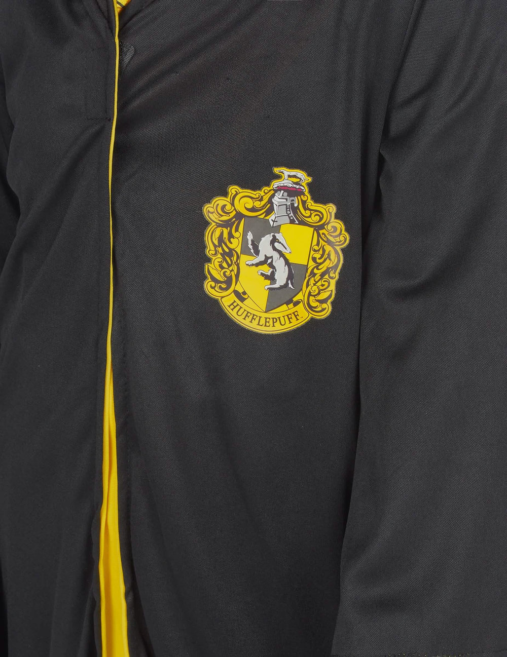 Detalle del escudo del disfraz clásico de Hufflepuff Harry Potter™ niño