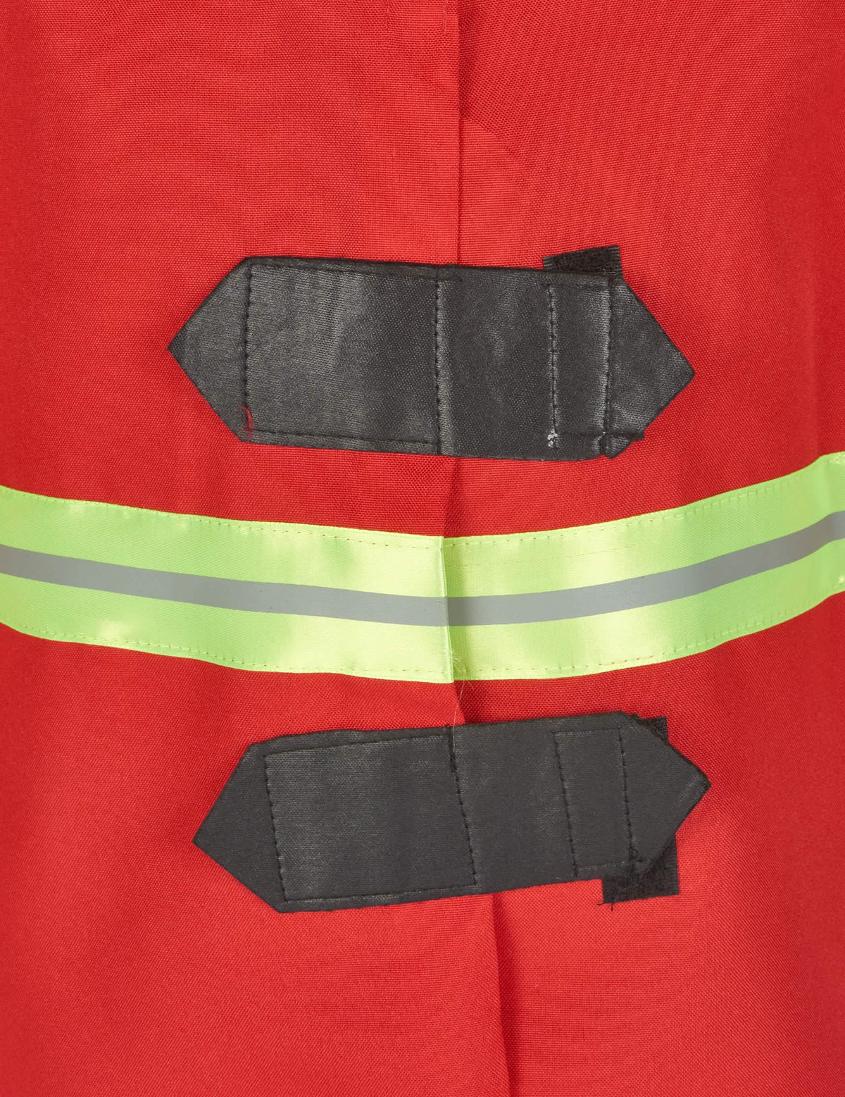 Détail des attaches et de la bande réfléchissante du déguisement de pompier pour enfant