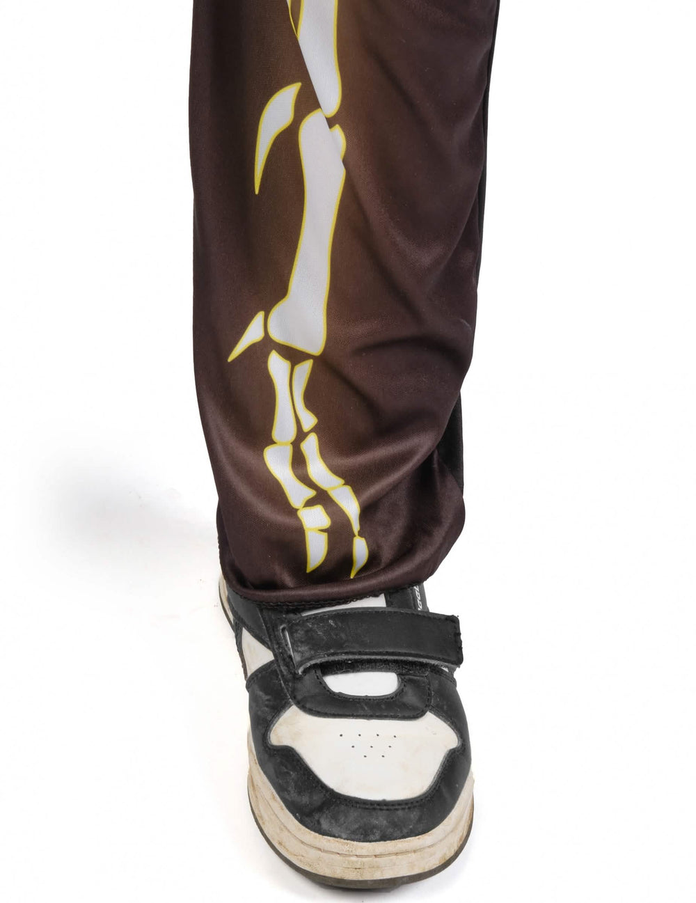Détail du bas du pantalon du déguisement squelette de dinosaure