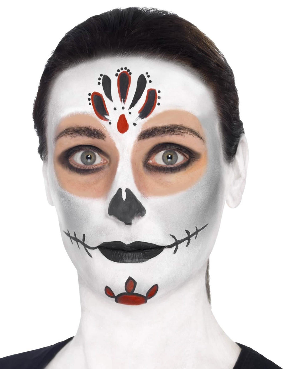 Gros plan sur le maquillage du visage du kit maquillage squelette coloré
