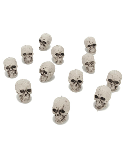 12 petites têtes de mort pour décoration en plastique blanc cassé