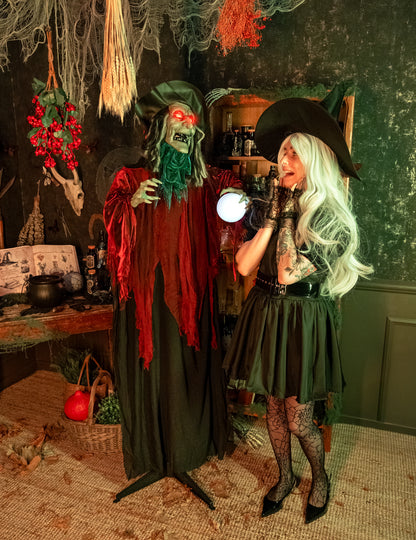 Sorcière maléfique animée pour décoration d'Halloween rouge et noire avec yeux lumineux