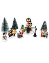 Santons de village de noël chorale du père noël pour décoration multicolore avec sapins et bonhomme de neige